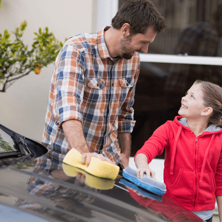 Fostering Dad and daughter cleaning car