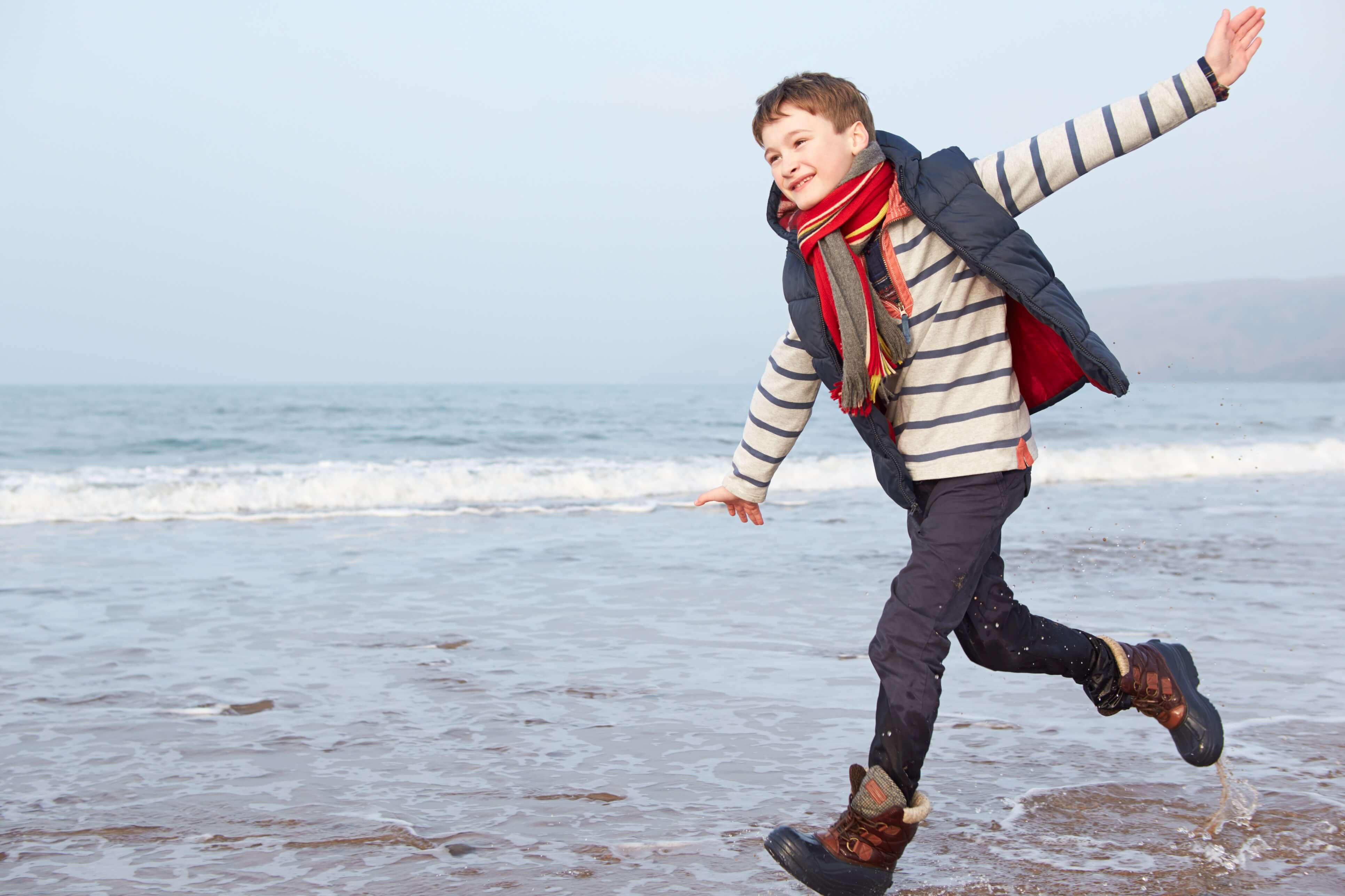 Boy running in the sea