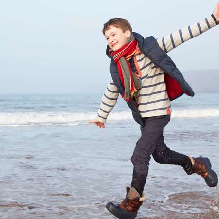 Boy running in the sea