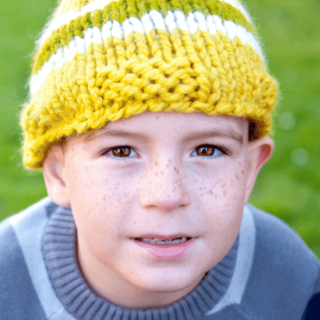 Boy in yellow beanie hat